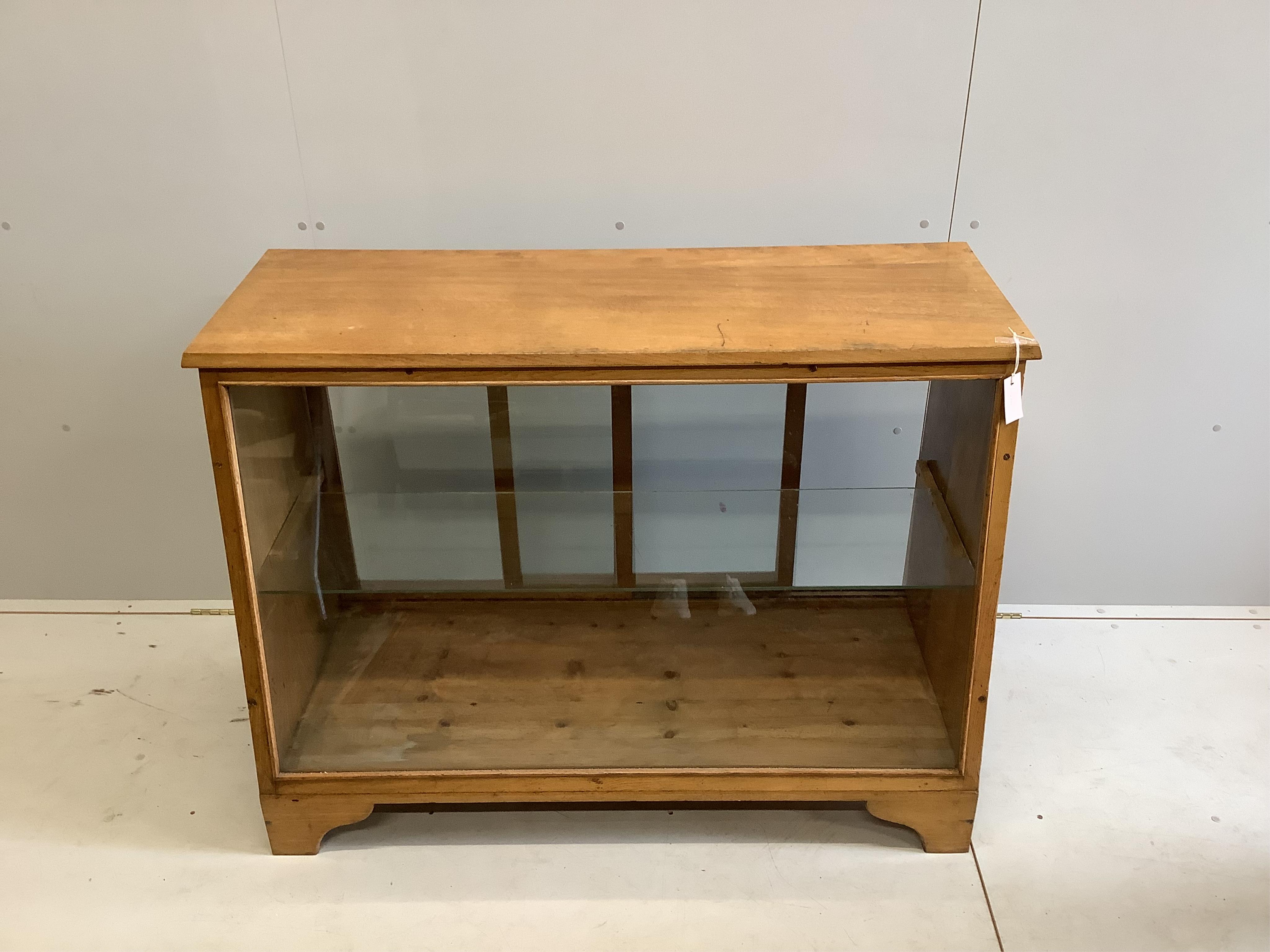 A mid century glazed oak haberdasher's cabinet, width 124cm, depth 56cm, height 90cm. Condition - fair